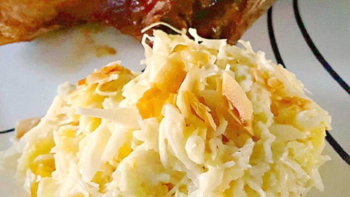 Savor the sweet and smoky harmony of pineapple barbeque chops paired with creamy colada slaw made with coconut chips and macadamia nuts. This dish brings people together and turns any meal into a mini celebration. #bbq #porkchop #pineapplesauce #pineapplebarbecue #PineappleBarbequeChops #ColadaSlaw #BBQlovers #SummerGrilling #TropicalFlavors