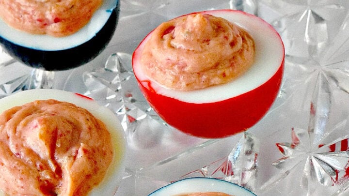 Wow the crowd with Red White & Blue Deviled Eggs, featuring a uniquely tangy roasted beet filling that sets these apart from the rest. Perfect for any patriotic celebration or family event. #deviledeggs #coloredeggs #patrioticfood #RWBDeviledEggs #PatrioticEats #SummerBBQRecipes #FourthofJulyFoods #FoodieFaves #FourthOfJulyFoodies #DeviledEggHeaven #AmericanTable #USAFeast