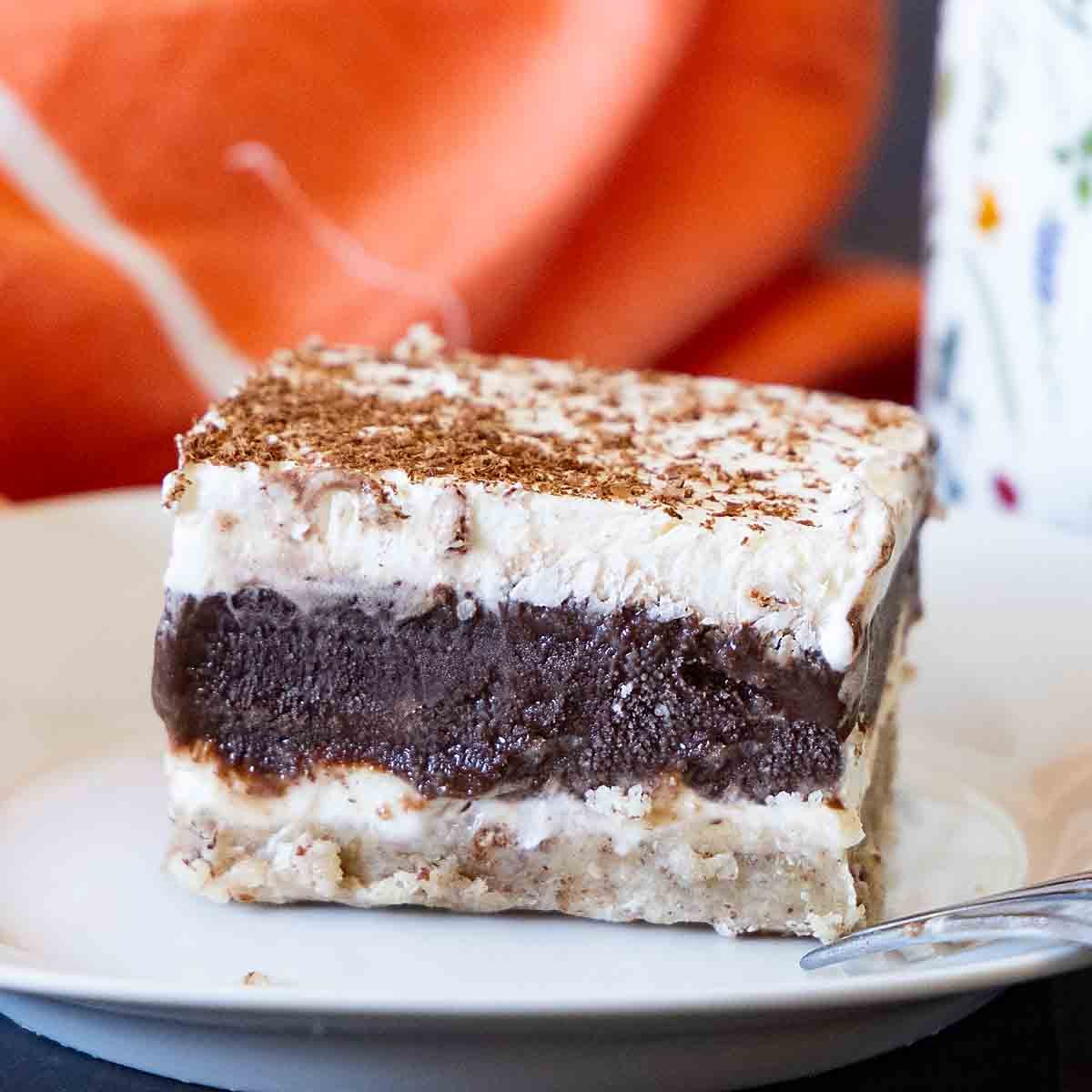 With a pecan cookie flavored base, topped with layers of chocolate and cheesecake, Chocolate Delight is a special summer dessert