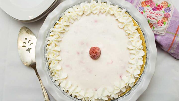 This No-Bake Strawberry Yogurt Pie blends Greek Yogurt, fresh or frozen berries & maple syrup for a pie that's healthier than many recipes.  Shhhh!