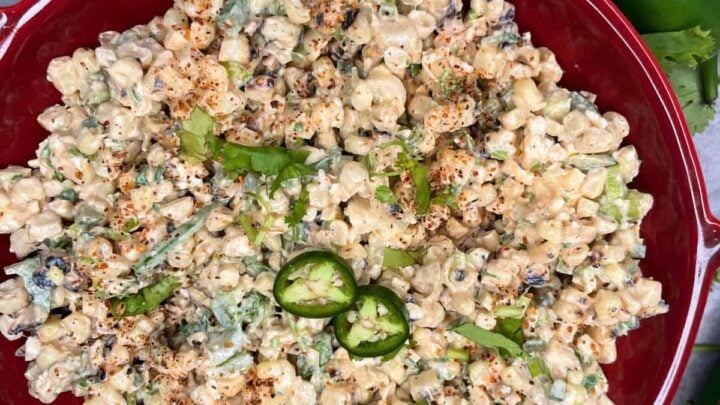 Esquites is a delicious Mexican street-food with tender corn kernels, creamy mayo and crema, tangy lime, salty Cotija cheese, chili powder, and fresh cilantro.