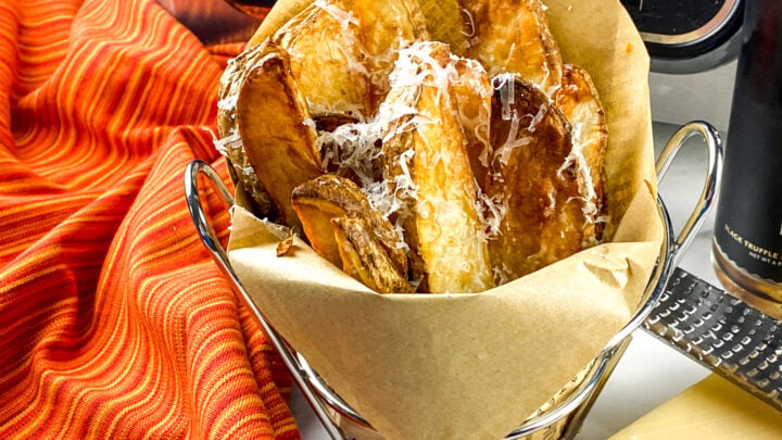 These delicious Parmesan Truffle Potato Wedges are a tasty snack, appetizer, or side dish needing only 4 ingredients and ready in 30 minutes.