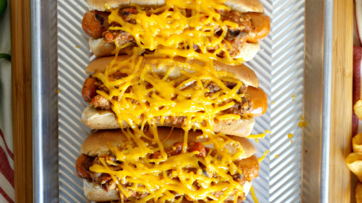 These Vegan Chili Cheese Dogs are loaded up with a homemade plant-based chili and melty cheese for a tasty indulgence that tastes like summertime!
