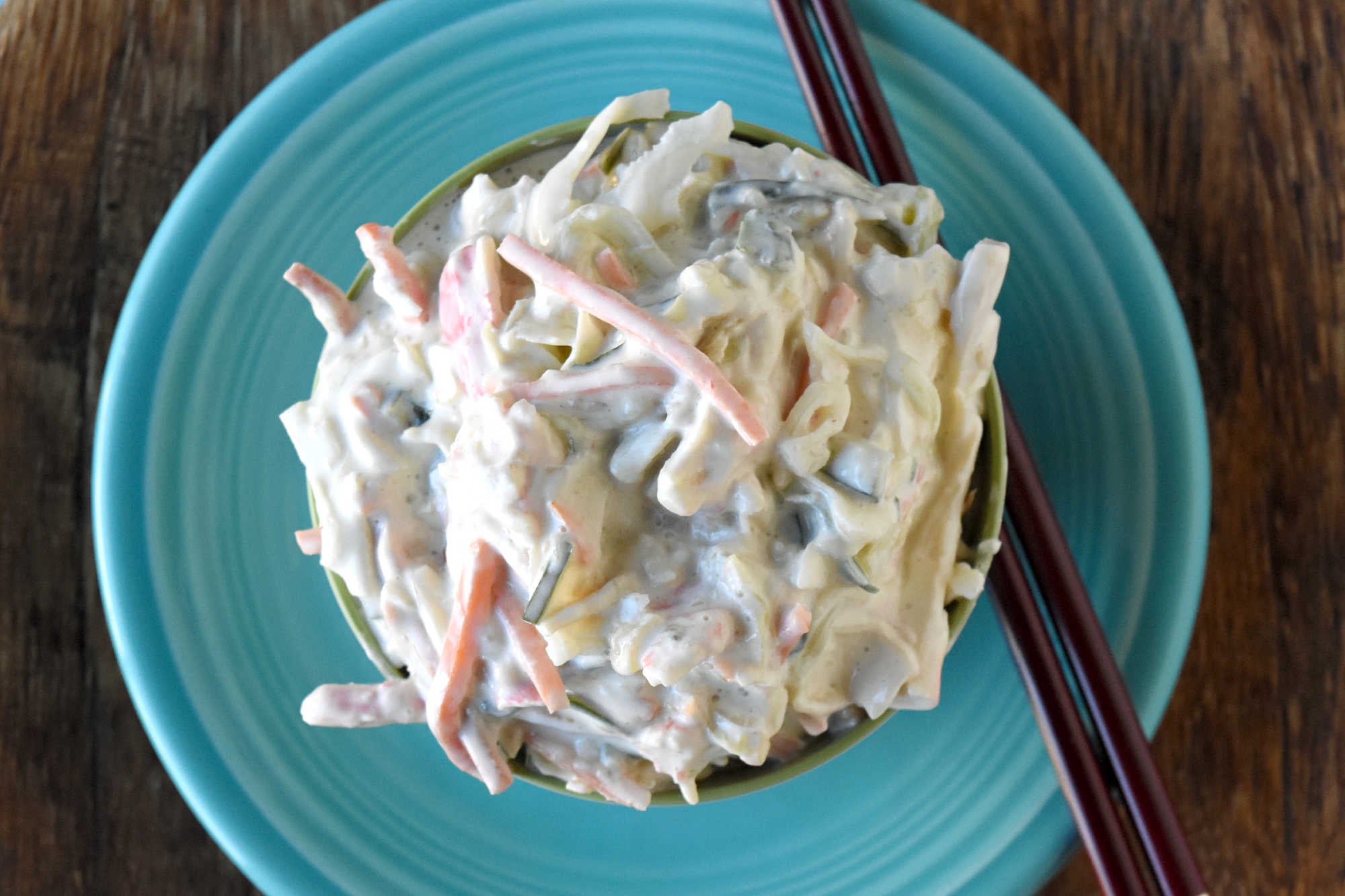 Cool, creamy, crunchy, and ready for sushi night at home. This Japanese kani salad uses imitation crab, crisp veggies, sesame, and spicy mayo dressing.  #kanisalad #japaneserecipe #sushinightathome #imitationcrab #seafoodsalad #easyasianrecipes #crunchysalad #weeknightrecipes #foodblogger #homemadejapanesefood
