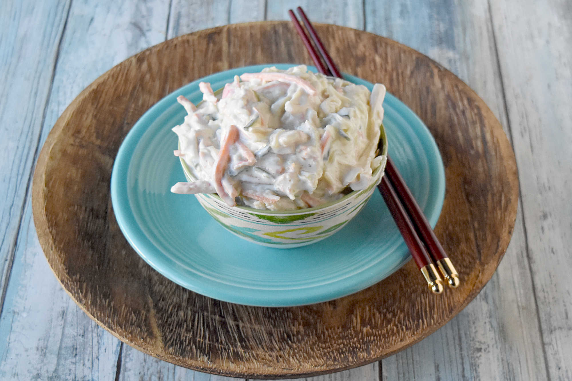 Cool, creamy, crunchy, and ready for sushi night at home. This Japanese kani salad uses imitation crab, crisp veggies, sesame, and spicy mayo dressing.  #kanisalad #japaneserecipe #sushinightathome #imitationcrab #seafoodsalad #easyasianrecipes #crunchysalad #weeknightrecipes #foodblogger #homemadejapanesefood