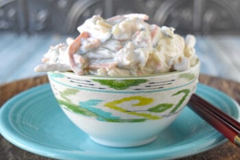 Cool, creamy, crunchy, and ready for sushi night at home. This Japanese kani salad uses imitation crab, crisp veggies, sesame, and spicy mayo dressing. #kanisalad #japaneserecipe #sushinightathome #imitationcrab #seafoodsalad #easyasianrecipes #crunchysalad #weeknightrecipes #foodblogger #homemadejapanesefood