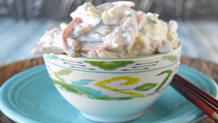 Cool, creamy, crunchy, and ready for sushi night at home. This Japanese kani salad uses imitation crab, crisp veggies, sesame, and spicy mayo dressing. #kanisalad #japaneserecipe #sushinightathome #imitationcrab #seafoodsalad #easyasianrecipes #crunchysalad #weeknightrecipes #foodblogger #homemadejapanesefood
