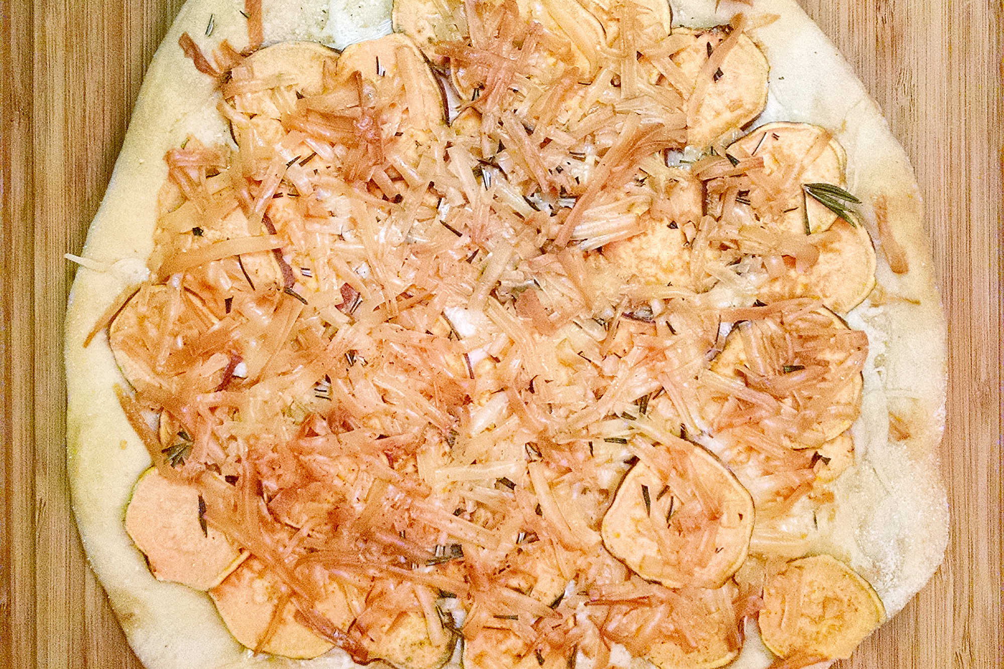 This rustic potato leek pizza uses thinly sliced russet potatoes, sweet leeks, garlic, mozzarella, and asiago on a store‑bought crust. A cozy homemade pizza perfect for easy weeknight dinners, National Potato Day, or anyone craving a unique potato pizza recipe with simple ingredients. #pizza #leek #potatoleekrecipe #pizzarecipe #meatless #potatoleekpizza #homemadepizza #pizzaloversunite #vegetarianeats #foodfromthegarden #MashupRecipe #PizzaRevolution