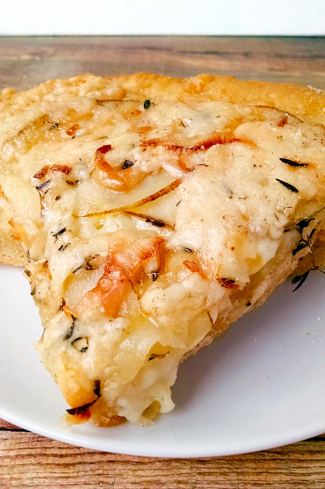 This rustic potato leek pizza uses thinly sliced russet potatoes, sweet leeks, garlic, mozzarella, and asiago on a store‑bought crust. A cozy homemade pizza perfect for easy weeknight dinners, National Potato Day, or anyone craving a unique potato pizza recipe with simple ingredients. #pizza #leek #potatoleekrecipe #pizzarecipe #meatless #potatoleekpizza #homemadepizza #pizzaloversunite #vegetarianeats #foodfromthegarden #MashupRecipe #PizzaRevolution