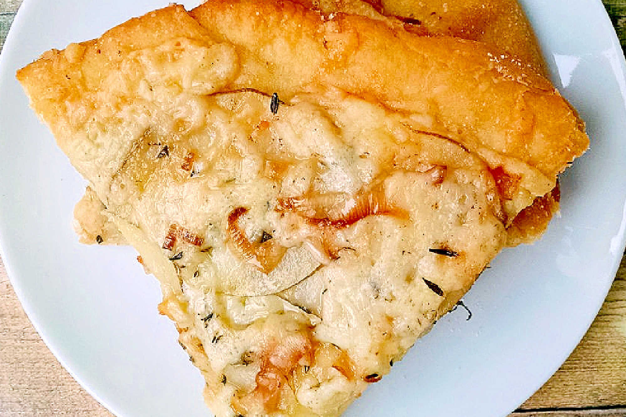 This rustic potato leek pizza uses thinly sliced russet potatoes, sweet leeks, garlic, mozzarella, and asiago on a store‑bought crust. A cozy homemade pizza perfect for easy weeknight dinners, National Potato Day, or anyone craving a unique potato pizza recipe with simple ingredients. #pizza #leek #potatoleekrecipe #pizzarecipe #meatless #potatoleekpizza #homemadepizza #pizzaloversunite #vegetarianeats #foodfromthegarden #MashupRecipe #PizzaRevolution