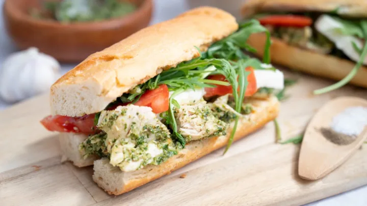 This Chicken Walnut Pesto Sandwich is fresh, hearty, and easy to make with homemade walnut pesto, mozzarella, tomato, and arugula.