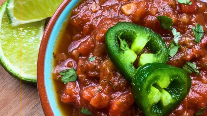 This homemade Spicy Salsa will kick up your meals with simple ingredients like tomatoes, onion, jalapeno, lime, and cilantro.