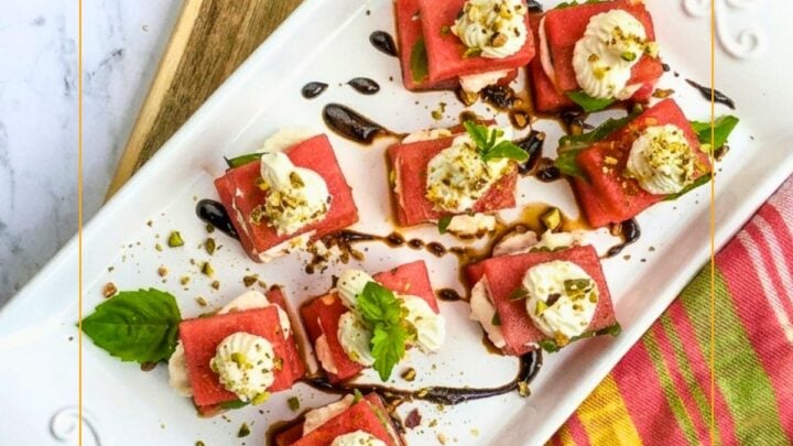 Watermelon Goat Cheese Bites are a perfect summer appetizer pairing watermelon, creamy cheeses, basil, pistachios and balsamic vinegar.