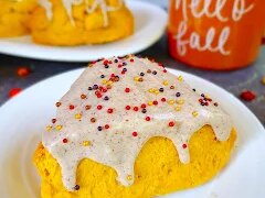 Glazed pumpkin spice scones are tender, buttery, and topped with a sweet pumpkin spice glaze for a perfect fall breakfast or treat.