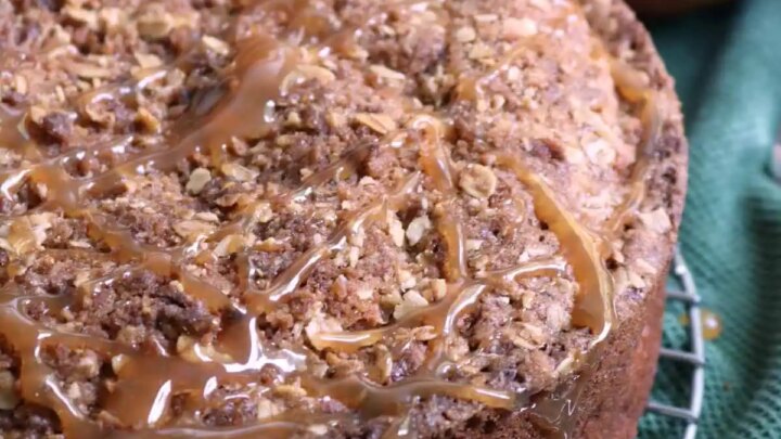 Caramel apple coffee cake combines tender spiced cake, fresh apple chunks, crunchy streusel, and a rich caramel drizzle with a subtle, aromatic infusion of fresh rosemary.