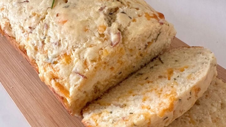Apple Cheddar Rosemary Bread is a savory quick bread with grated apple, sharp cheddar, rosemary, and the tender texture of a cheese biscuit.