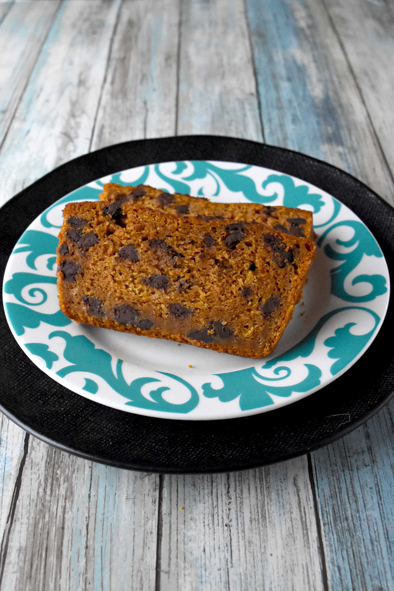 Soft pumpkin bread, melty chocolate chips, and a cozy gingerbread spice twist make this loaf feel like fall in every slice. Serve it with coffee, brunch, or a quiet afternoon treat.  #PumpkinBread #ChocolateChipBread #FallBaking #PumpkinRecipes #QuickBread #FallFlavors #CozyBakes #AutumnRecipes