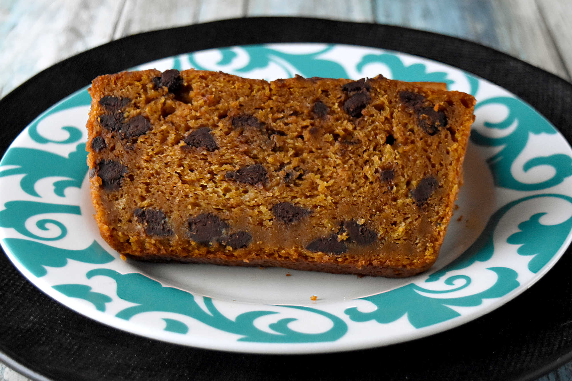 Soft pumpkin bread, melty chocolate chips, and a cozy gingerbread spice twist make this loaf feel like fall in every slice. Serve it with coffee, brunch, or a quiet afternoon treat.  #PumpkinBread #ChocolateChipBread #FallBaking #PumpkinRecipes #QuickBread #FallFlavors #CozyBakes #AutumnRecipes