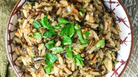 A perfect side dish for fall (or anytime!) this Instant Pot Wild Rice Pilaf is hearty and delicious. Great with any main dish!