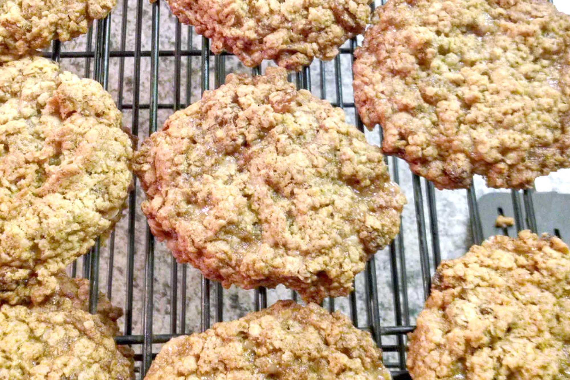 Classic oatmeal raisin cookies meet buttery candy-shop crunch in this chewy toffee cookie recipe. These Oatmeal Raisin Toffe Cookies are cozy enough for fall baking and fun enough for a cookie tray.  #OatmealCookies #RaisinCookies #ToffeeCookies #CookieRecipe #HolidayBaking #OurFamilyTable